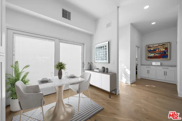 a kitchen with sink cabinets and microwave