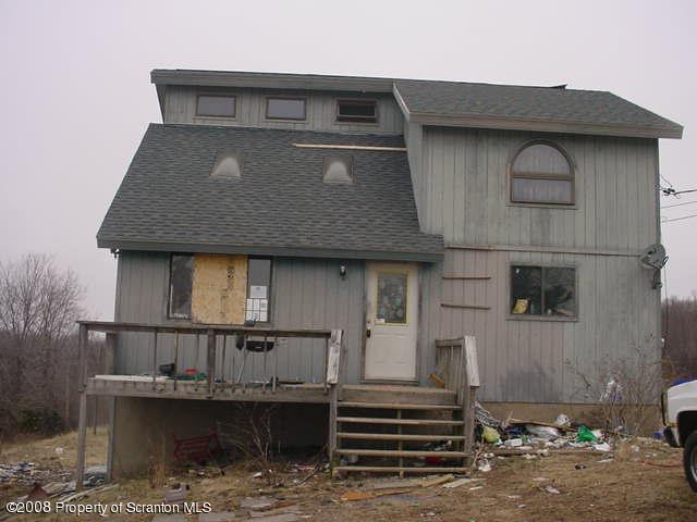 172 Spudeno Rd Tr Factoryville, PA 18419 - Photo 1 of 6 a front view of a house with balcony