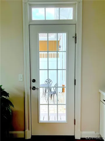 a view of a porch with dining table and chairs