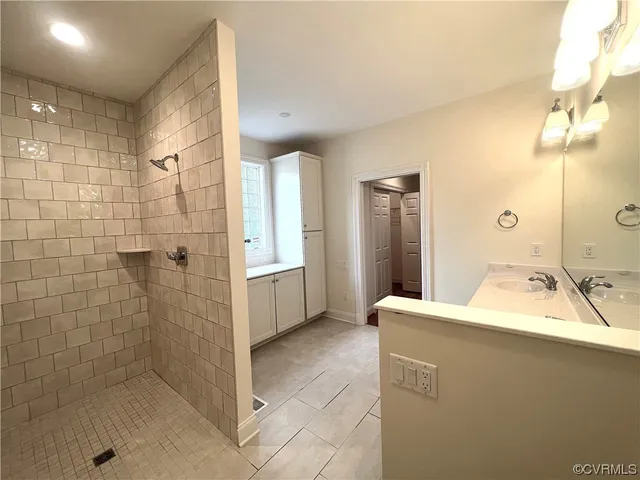 a bathroom with a sink and shower
