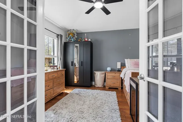 a kitchen with stainless steel appliances kitchen island granite countertop a refrigerator a stove a sink a dining table and chairs