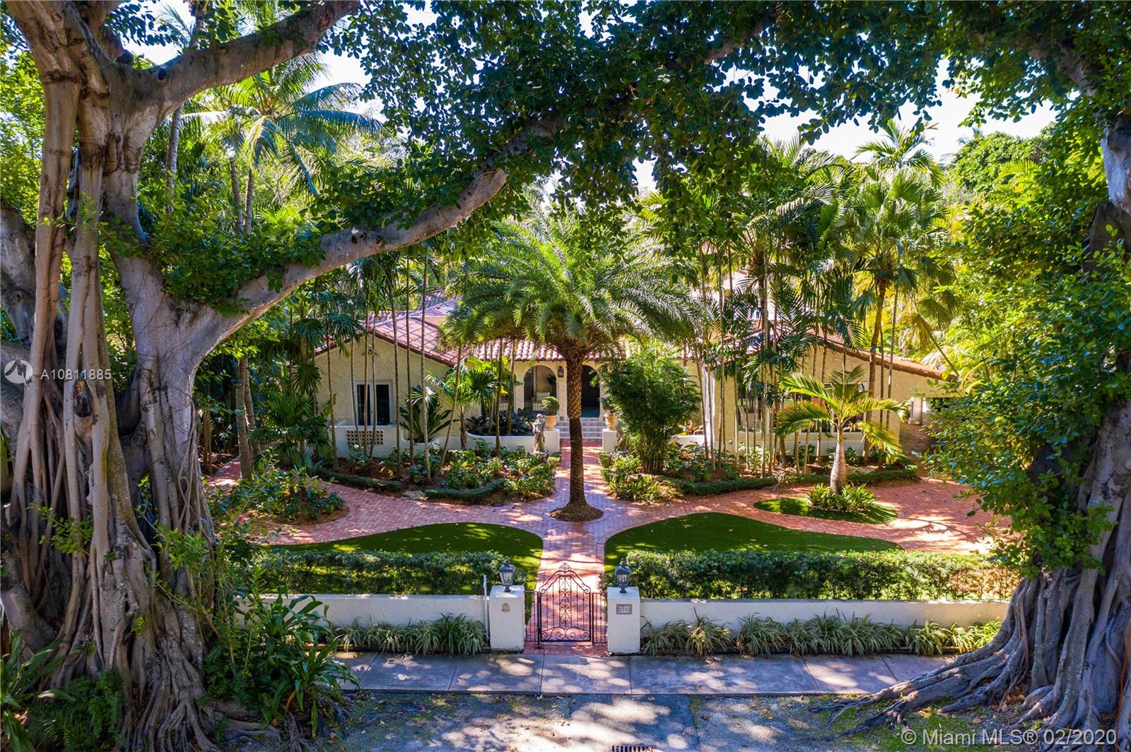 Aerial view of the home framed by banyan trees