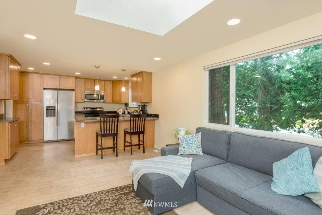12525 Southeast 99th Street Renton, WA 98056 - Photo 11 of 33 a living room with furniture and kitchen view