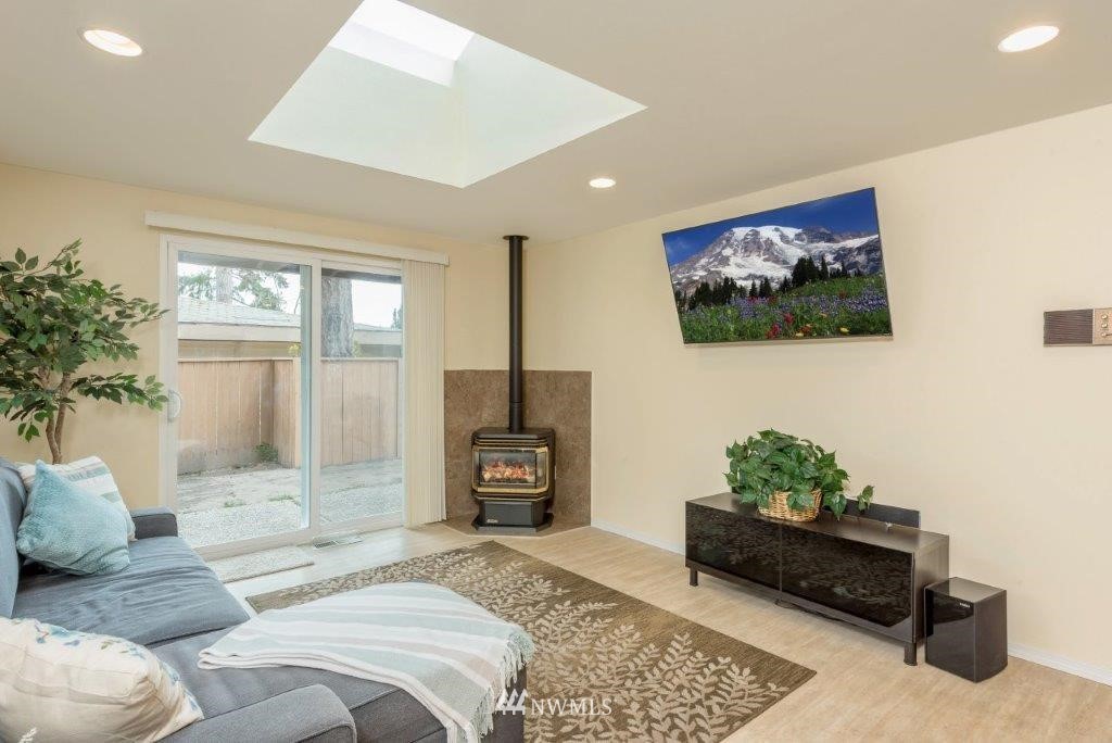12525 Southeast 99th Street Renton, WA 98056 - Photo 13 of 33 a bedroom with a bed and a couch