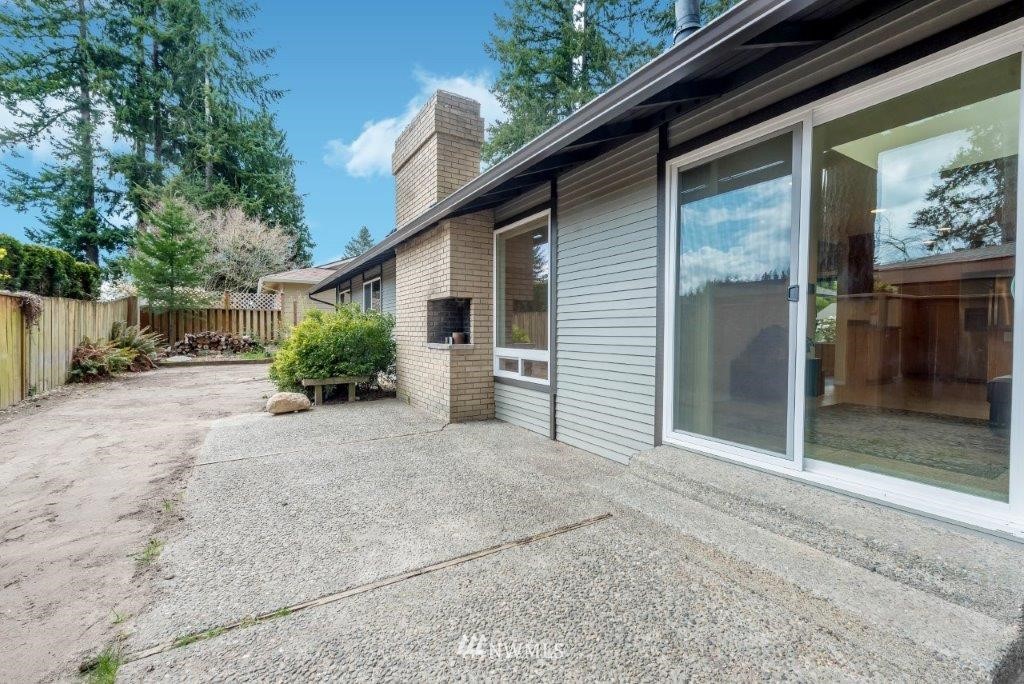 12525 Southeast 99th Street Renton, WA 98056 - Photo 28 of 33 a view of backyard with wheel chair and potted plants