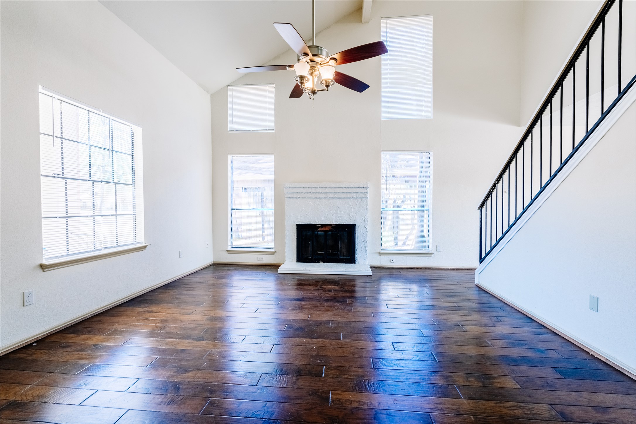 17030 Kirkchapel Street Spring, TX 77379 - Photo 4 of 28 a view of an empty room with wooden floor and a window