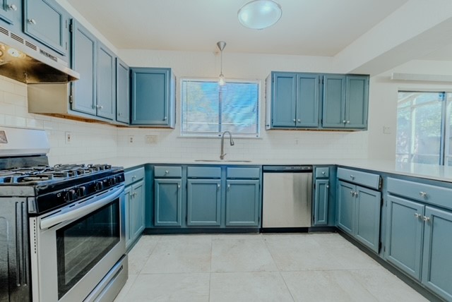 17030 Kirkchapel Street Spring, TX 77379 - Photo 9 of 28 a kitchen with granite countertop a stove and a sink
