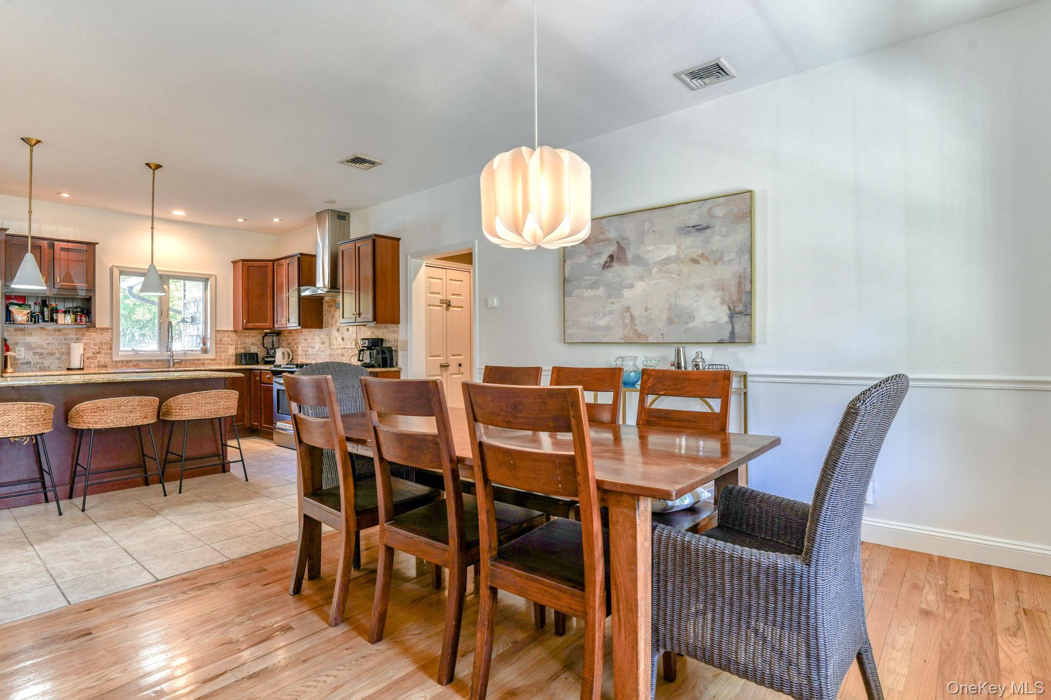 54 Borden Road Walden, NY 12586 - Photo 46 of 46 a view of a dining room with furniture and wooden floor