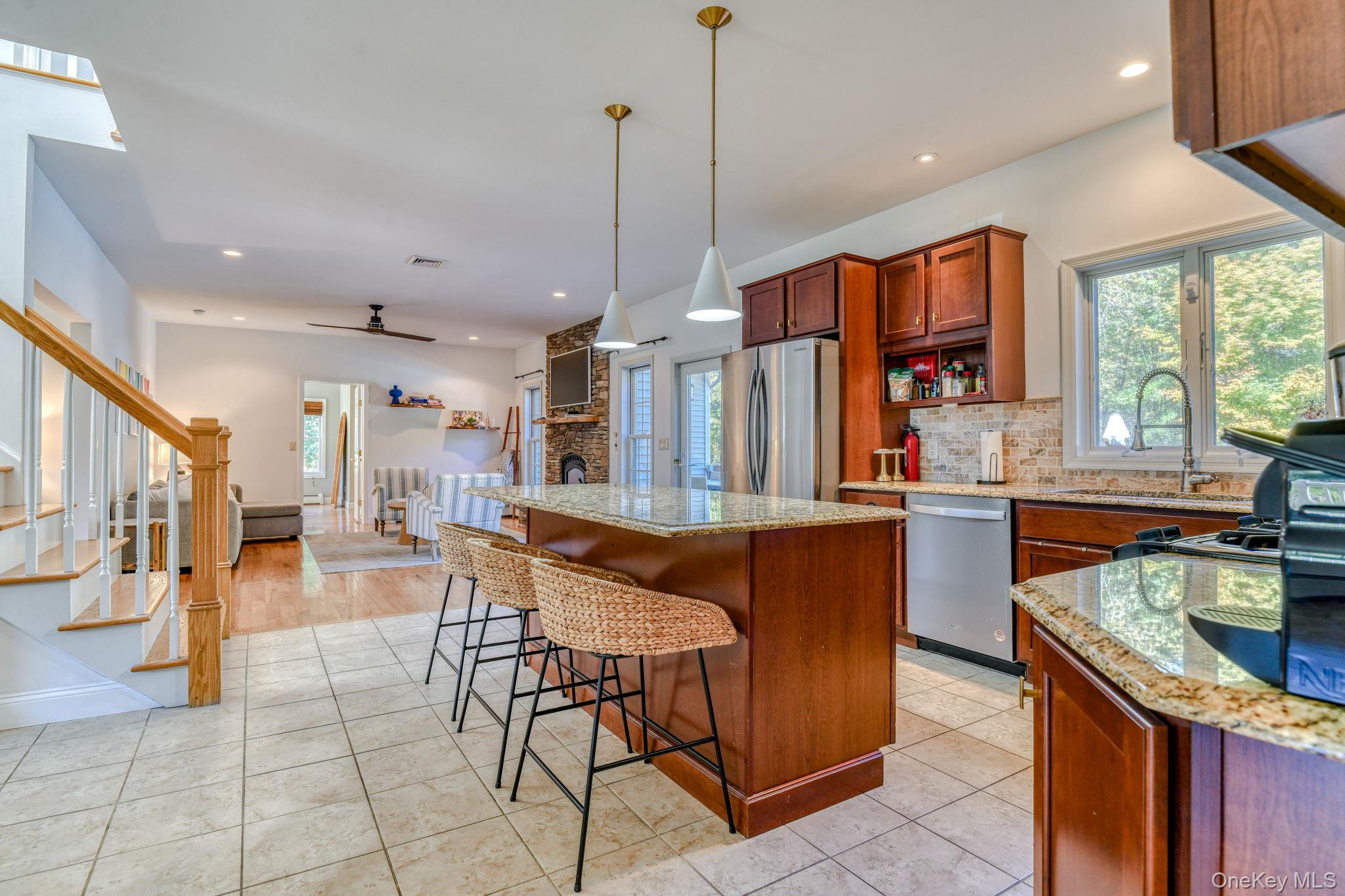 54 Borden Road Walden, NY 12586 - Photo 12 of 46 a kitchen with stainless steel appliances granite countertop a sink a stove and a refrigerator