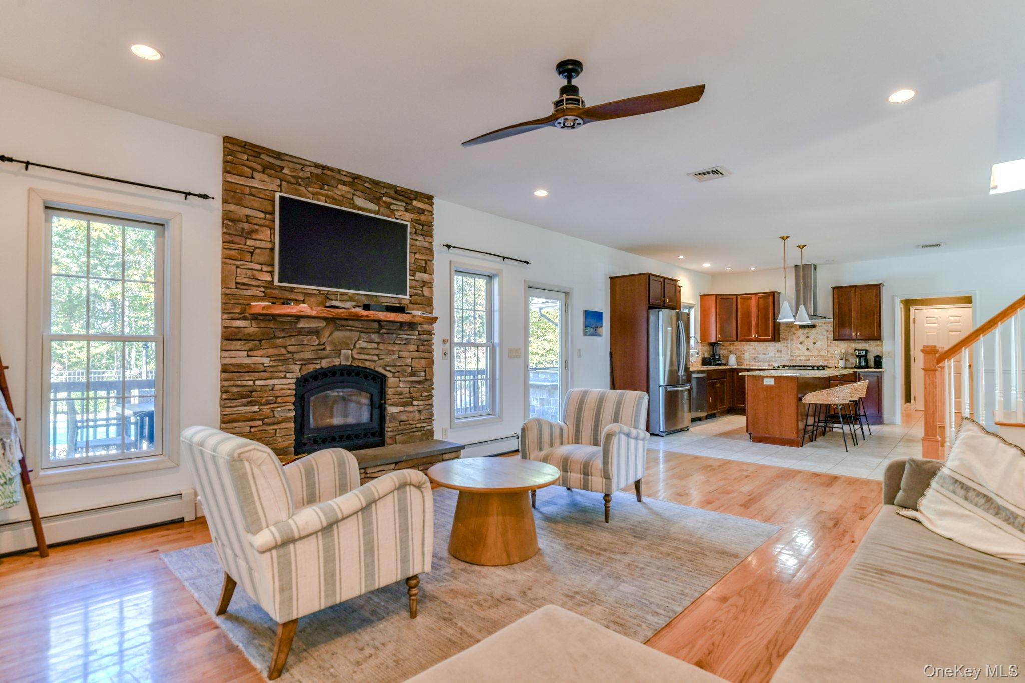 54 Borden Road Walden, NY 12586 - Photo 13 of 46 a living room with furniture wooden floor and a fireplace