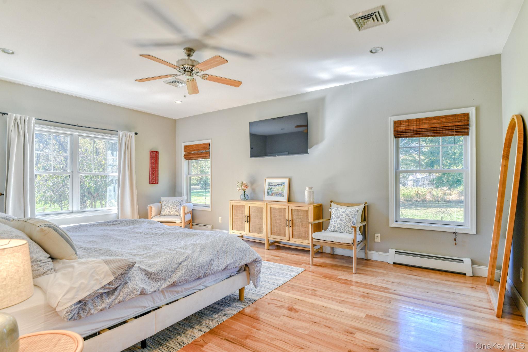 54 Borden Road Walden, NY 12586 - Photo 16 of 46 a bedroom with a bed and wooden floor