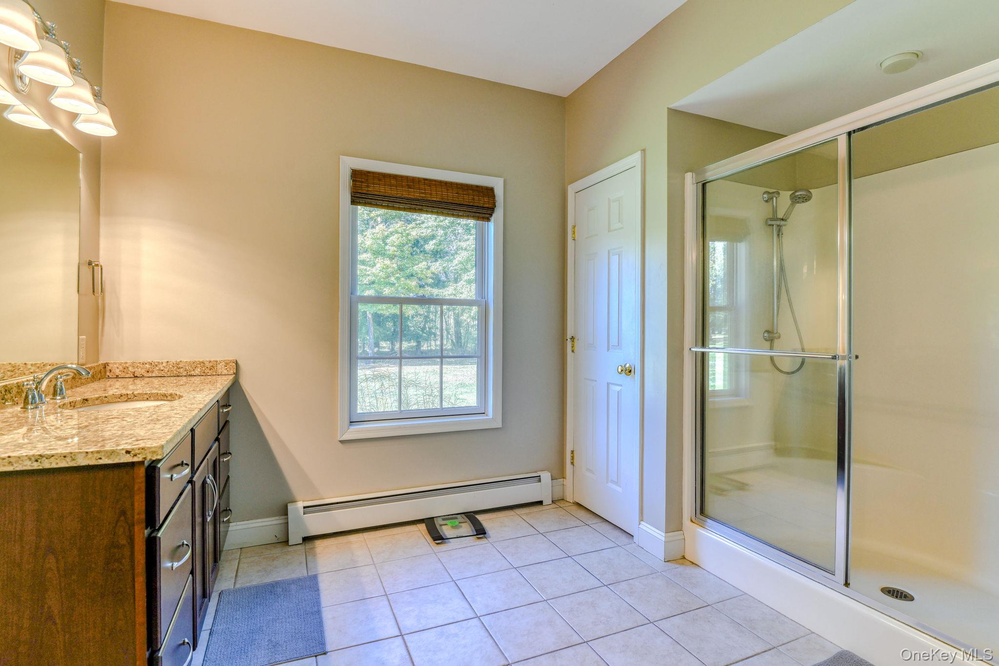 54 Borden Road Walden, NY 12586 - Photo 18 of 46 a view of a bathroom with a tub shower and a sink
