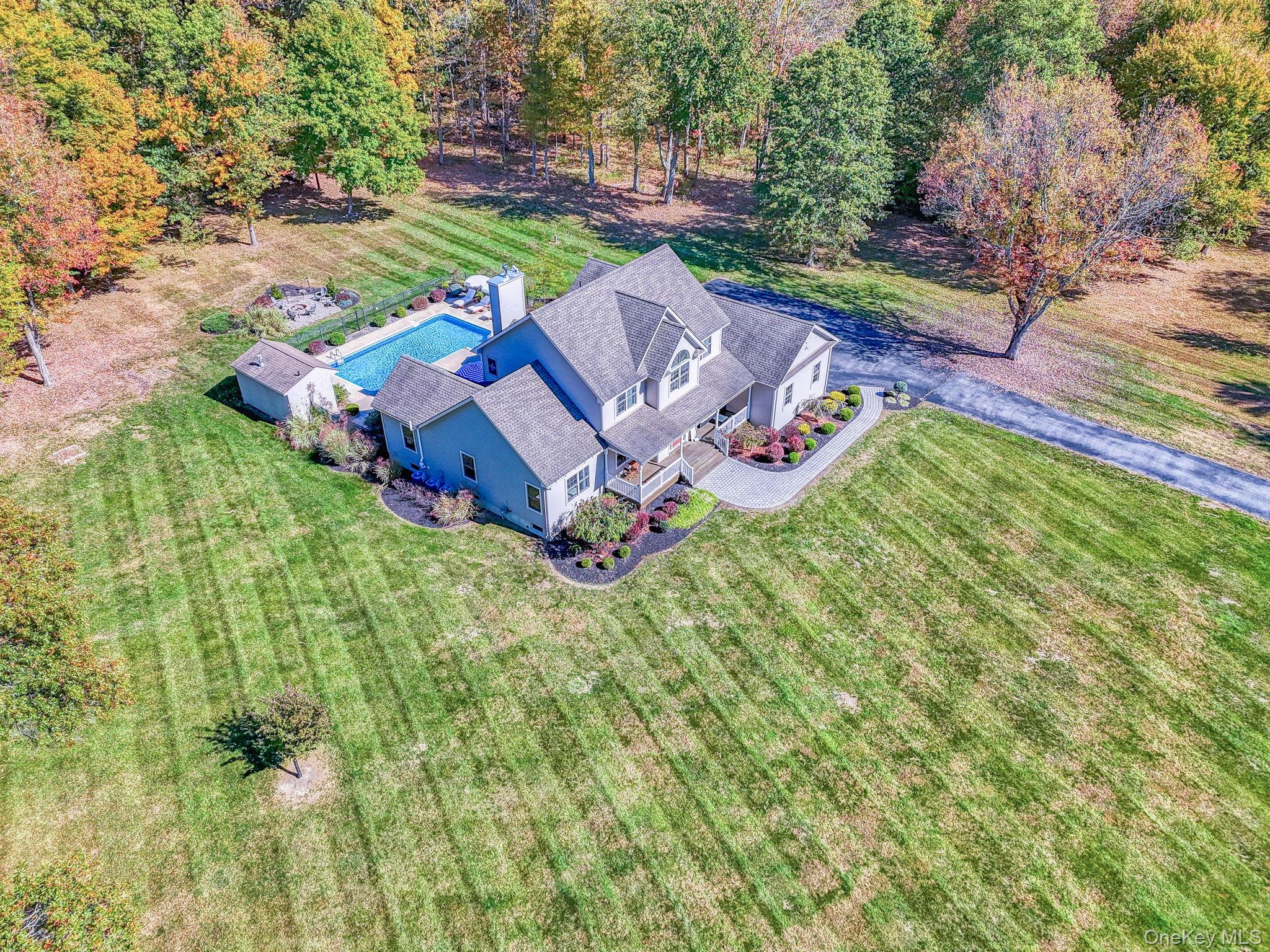 54 Borden Road Walden, NY 12586 - Photo 2 of 46 an aerial view of a house with a garden and swimming pool