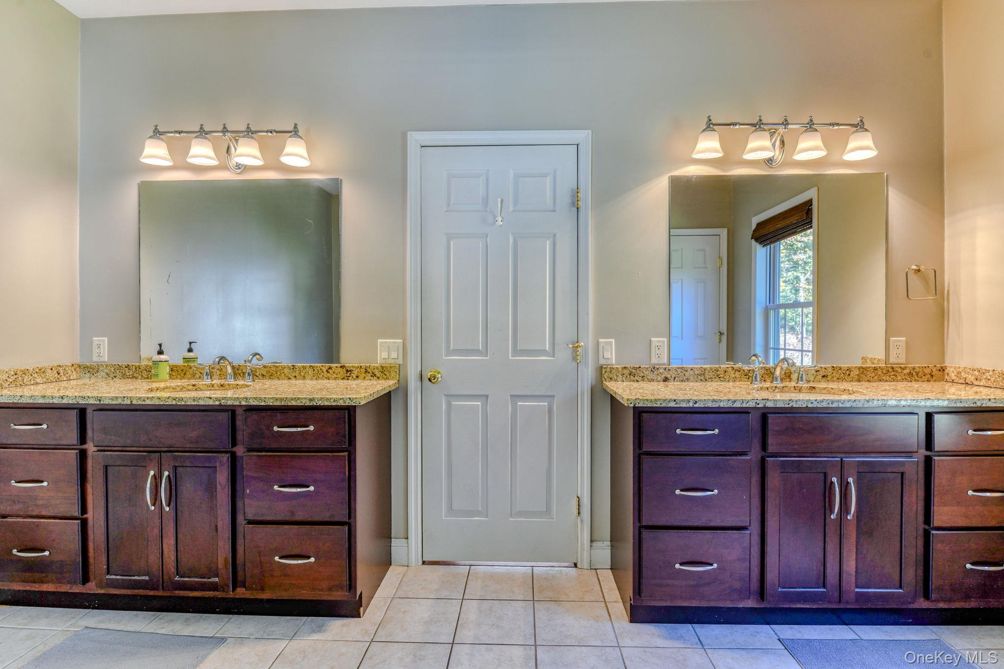 54 Borden Road Walden, NY 12586 - Photo 19 of 46 a bathroom with a granite countertop sink and a mirror