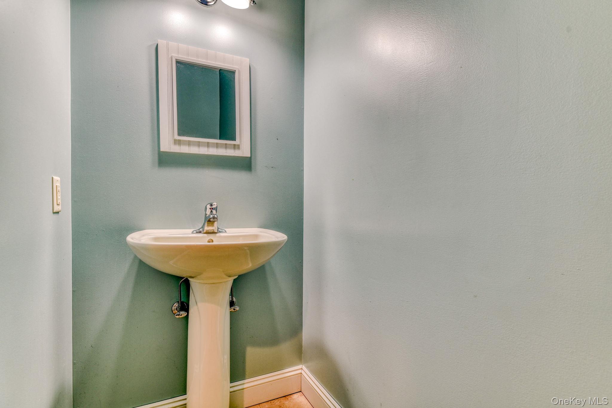 54 Borden Road Walden, NY 12586 - Photo 21 of 46 a bathroom with a sink a mirror and toilet