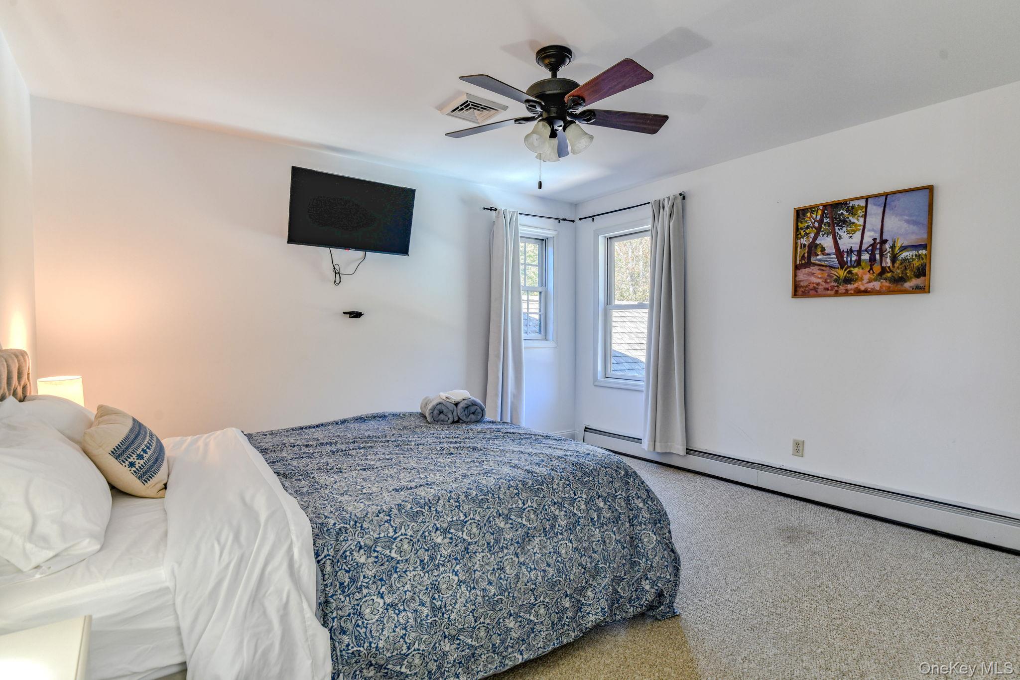 54 Borden Road Walden, NY 12586 - Photo 23 of 46 a bedroom with a bed and a flat screen tv
