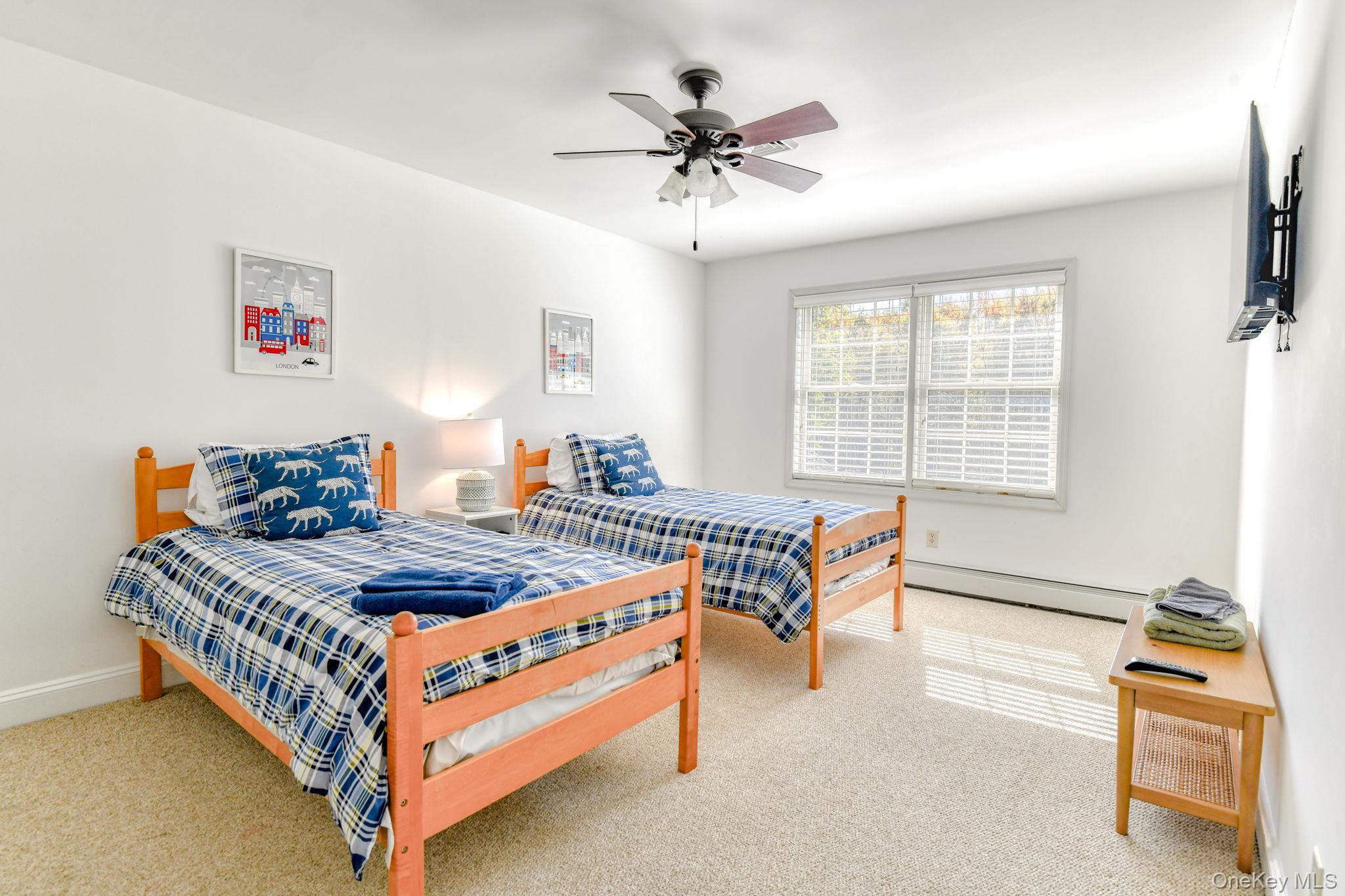 54 Borden Road Walden, NY 12586 - Photo 27 of 46 a bedroom with furniture and a chandelier