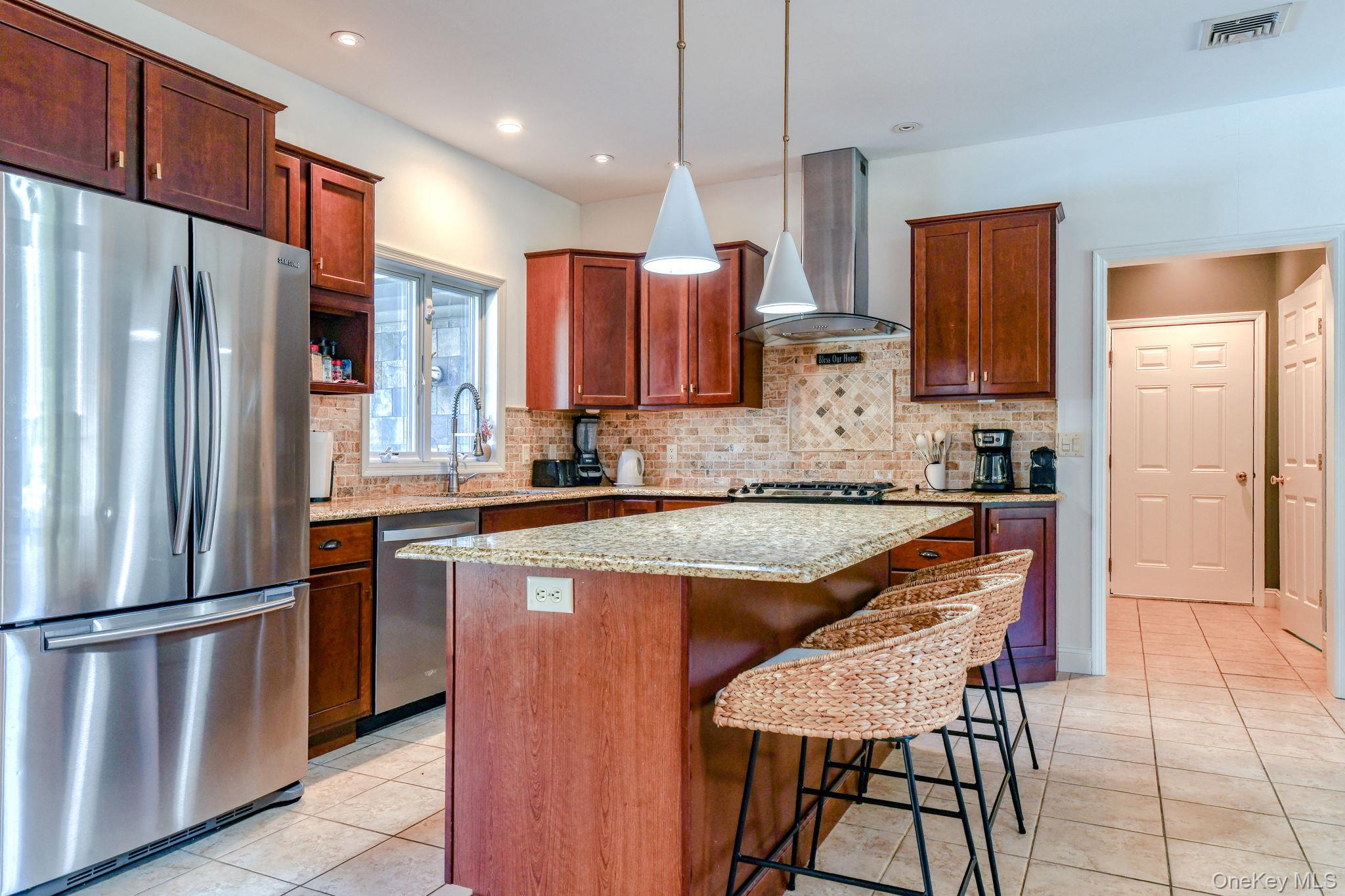 54 Borden Road Walden, NY 12586 - Photo 7 of 46 a kitchen with stainless steel appliances granite countertop a refrigerator a stove a sink and a microwave