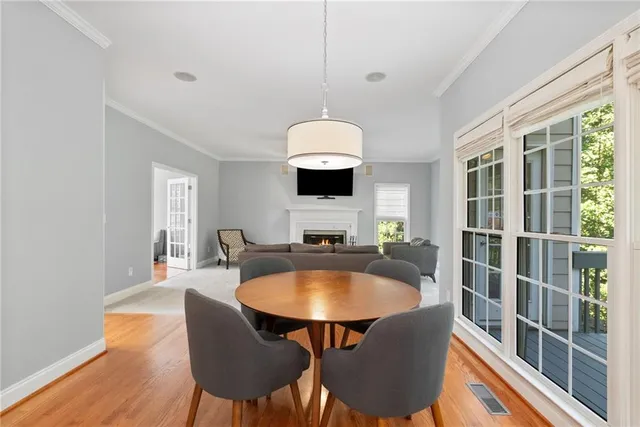 a dining room with furniture and window