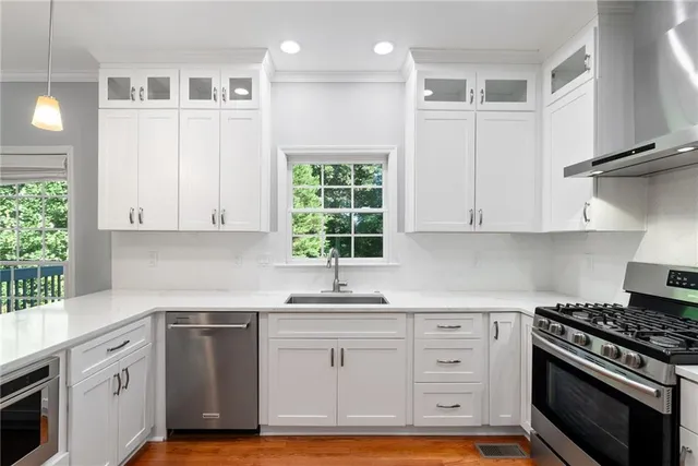 a kitchen with a sink and a window