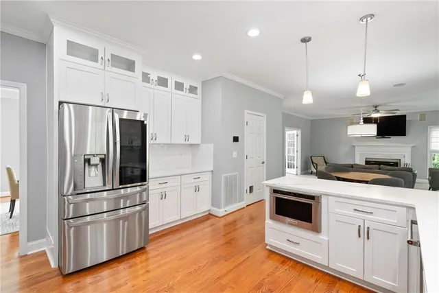 a kitchen with a sink a stove and cabinets
