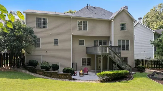 a front view of house with yard and outdoor seating