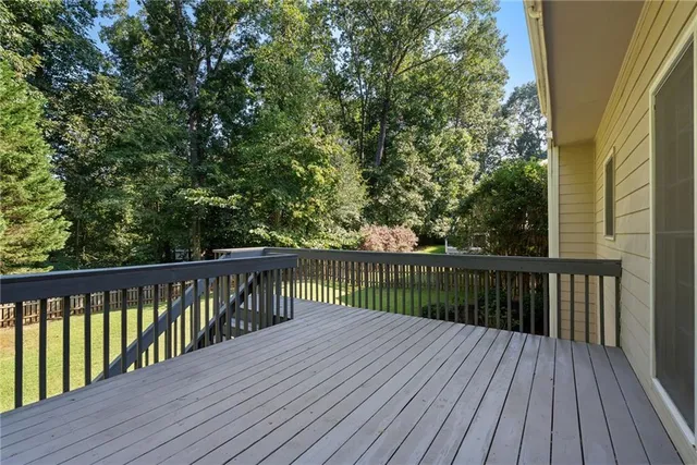 a view of a house with yard and sitting area