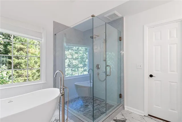 a bathroom with a granite countertop sink mirror and vanity