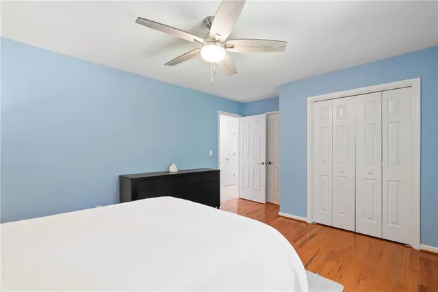 a room with pool table and windows