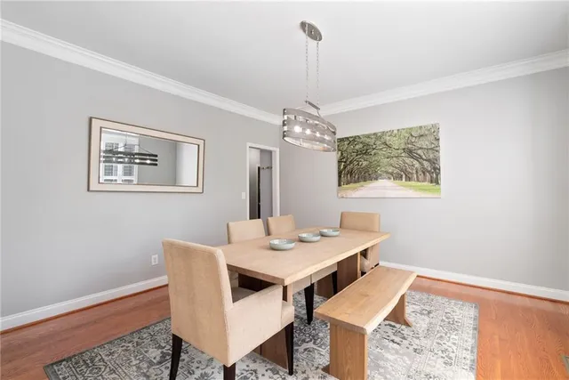 a dining room with a table and chairs