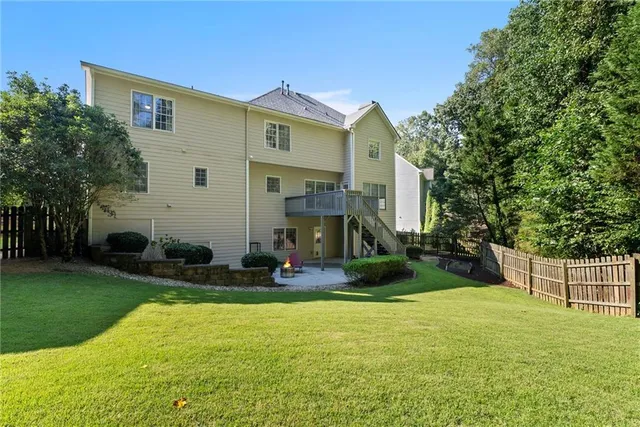 an outdoor sitting area with furniture