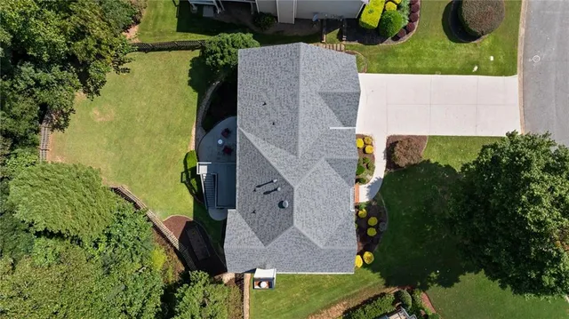 an aerial view of a house with outdoor space