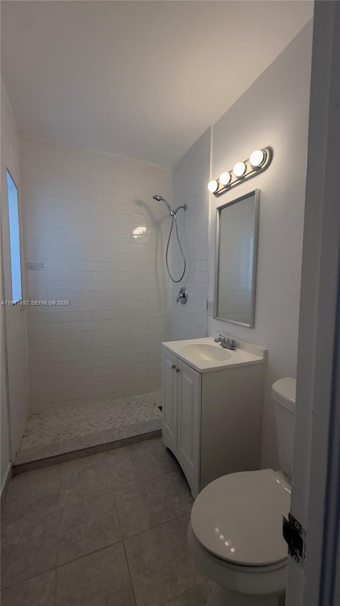 2000 Southwest 13th Court Miami, FL 33145 - Photo 14 of 22 a bathroom with a toilet sink and mirror