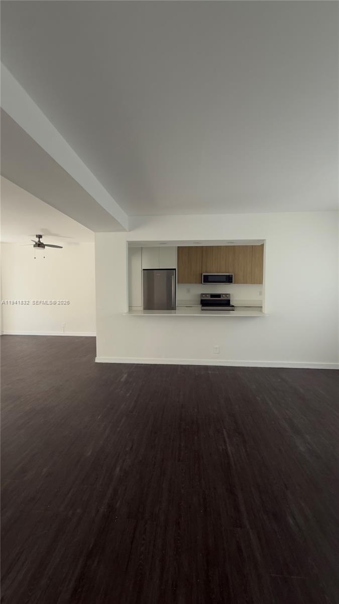 2000 Southwest 13th Court Miami, FL 33145 - Photo 17 of 22 a view of an empty room with wooden floor and a window