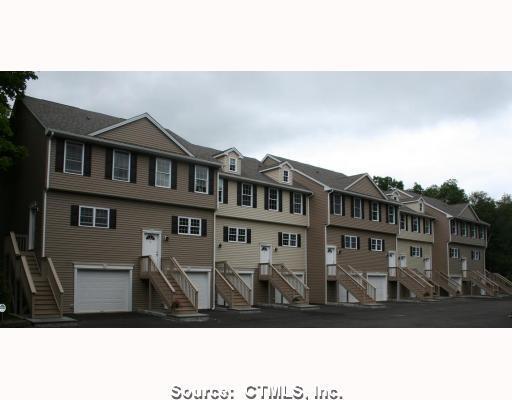 697 Beacon Valley Road, Unit 6 Naugatuck, CT 06770 - Photo 1 of 1 a black and white photo of a building