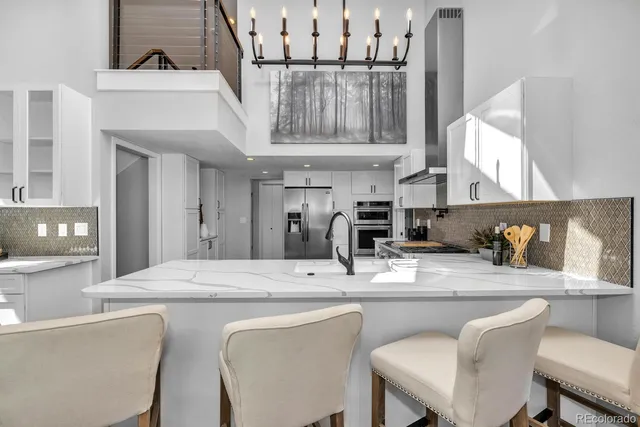 a dining table with chairs and cabinets