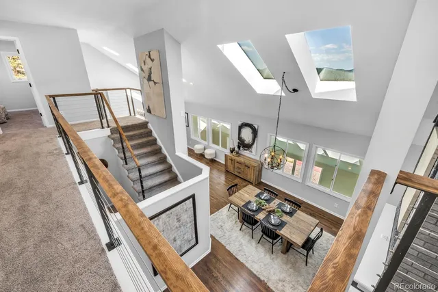 a view of an entryway with wooden floor