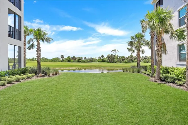 a view of a lake with a big yard