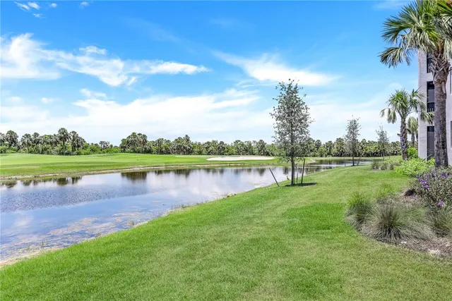 a view of a lake with houses in the back