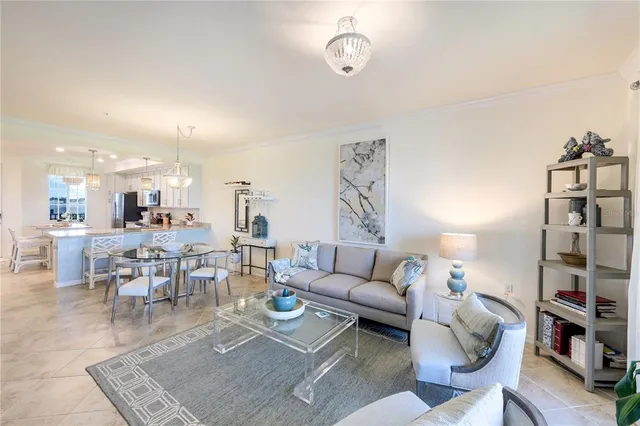 a living room with furniture a rug and a table