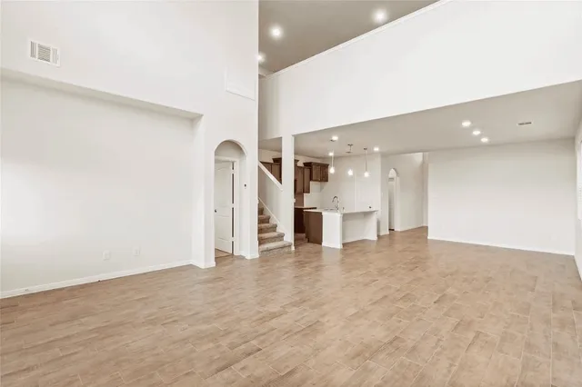 a view of a kitchen with a refrigerator and a window