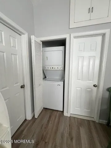 a view of a room with wooden floor and closet