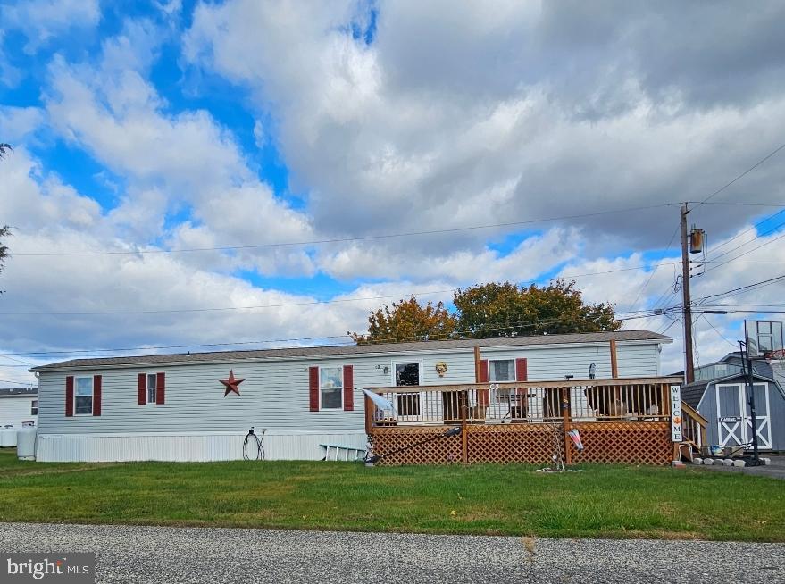 2 New Bridge Road, Unit C3 Salem, NJ 08079 - Photo 1 of 14 a front view of a house with a garden and yard