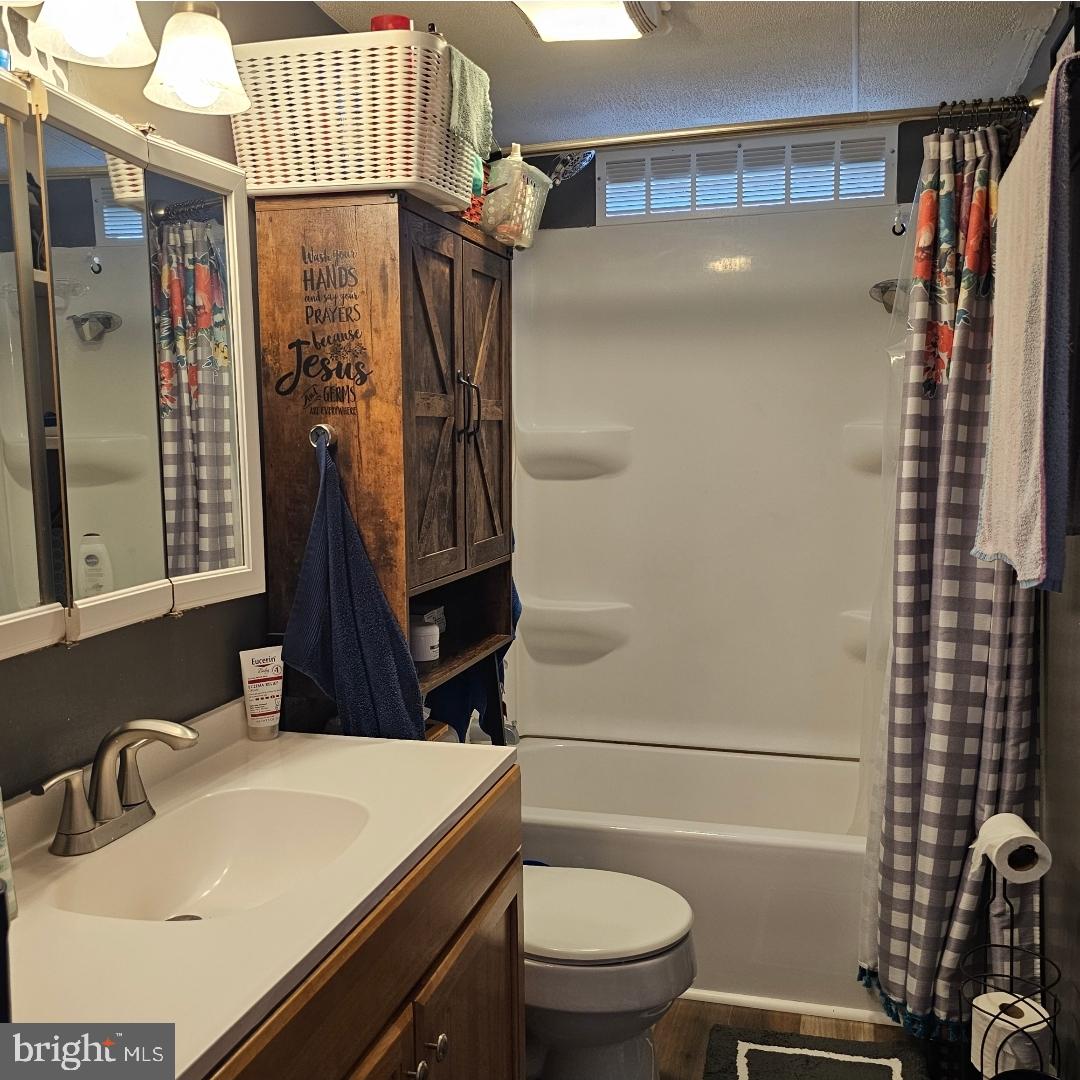 2 New Bridge Road, Unit C3 Salem, NJ 08079 - Photo 11 of 14 a bathroom with a sink toilet and shower