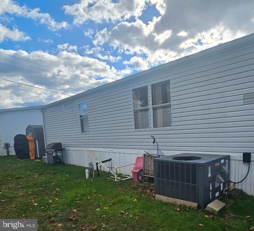 2 New Bridge Road, Unit C3 Salem, NJ 08079 - Photo 2 of 14 a backyard of a house with table and chairs