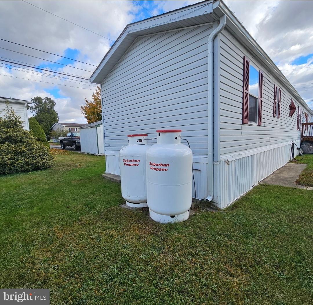 2 New Bridge Road, Unit C3 Salem, NJ 08079 - Photo 4 of 14 a white house sitting in middle of the grass