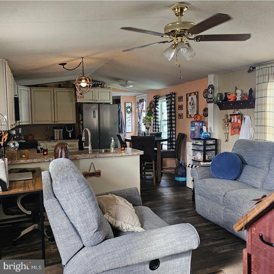 2 New Bridge Road, Unit C3 Salem, NJ 08079 - Photo 5 of 14 a living room with furniture and a chandelier
