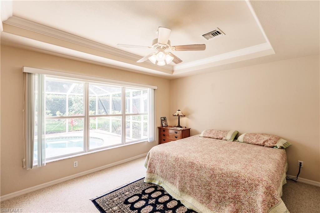 19628 Villa Rosa Loop Estero, FL 33967 - Photo 15 of 25 a bedroom with a large bed and a large window
