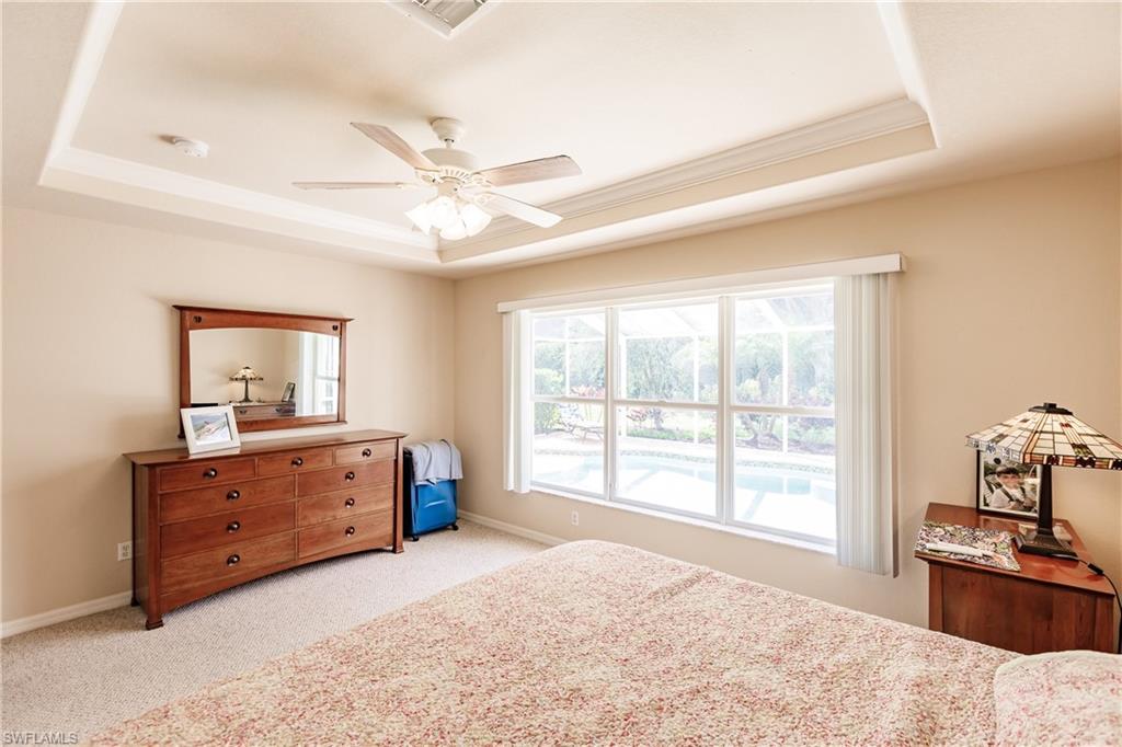 19628 Villa Rosa Loop Estero, FL 33967 - Photo 16 of 25 a bedroom with a bed and large windows