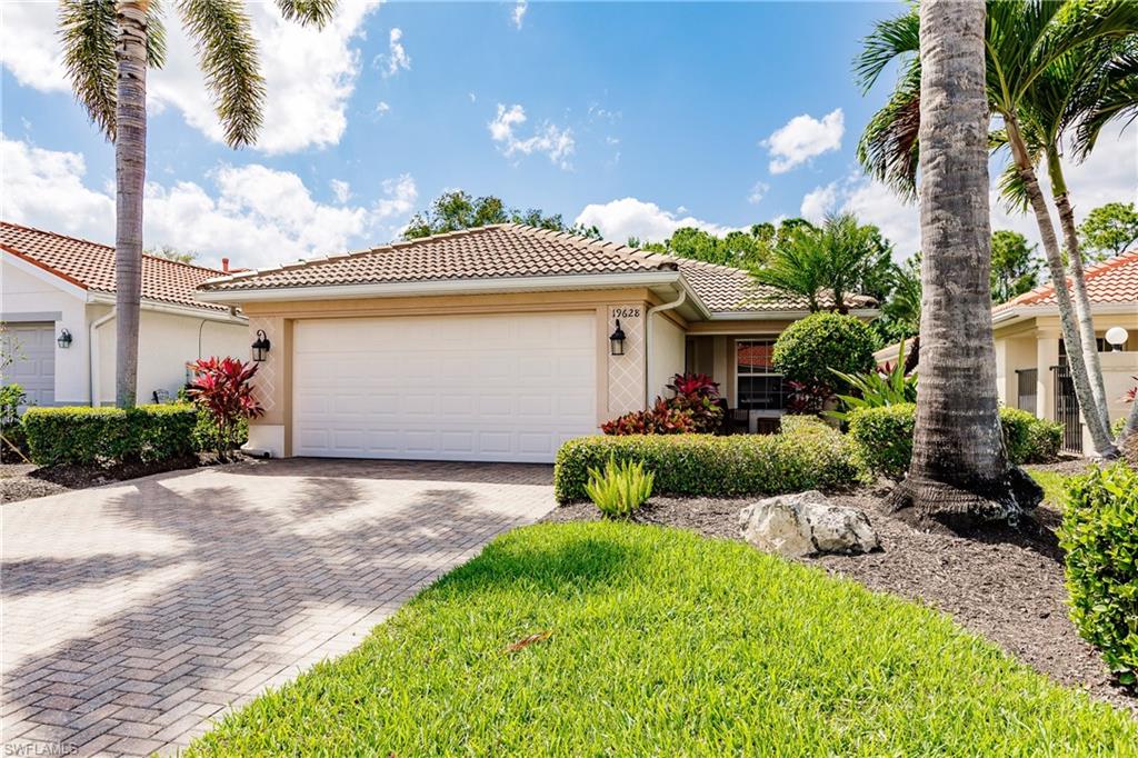19628 Villa Rosa Loop Estero, FL 33967 - Photo 2 of 25 a front view of a house with garden